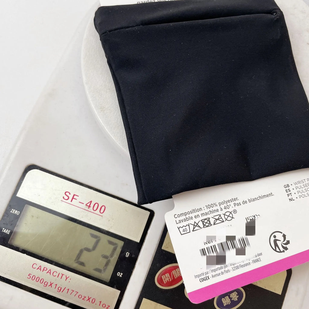 Black wrist armband with adjustable strap and a 10cm by 10.5cm main compartment for a mobile phone.