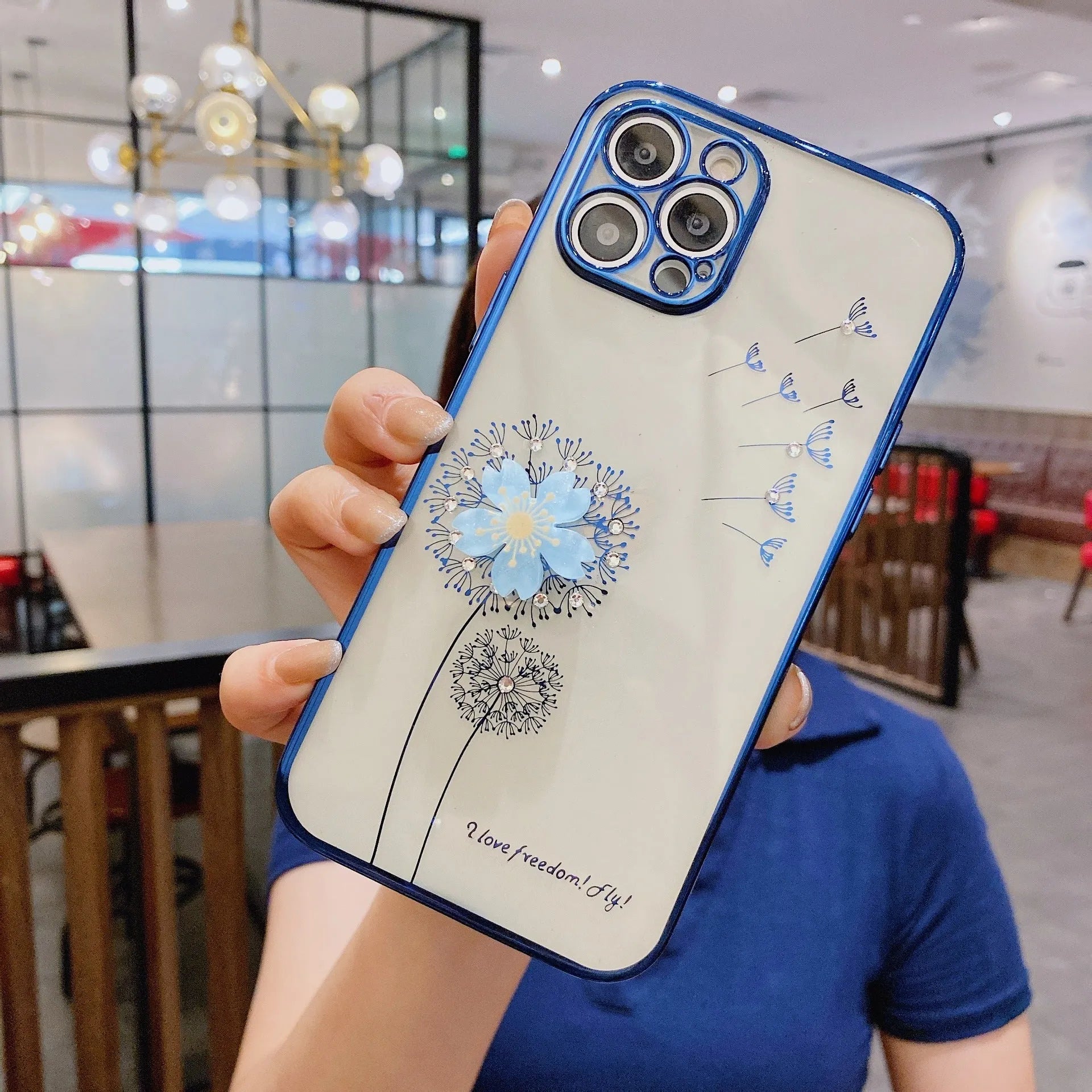 Green iPhone case with 3D floral design and a rotating kickstand extended from the back.