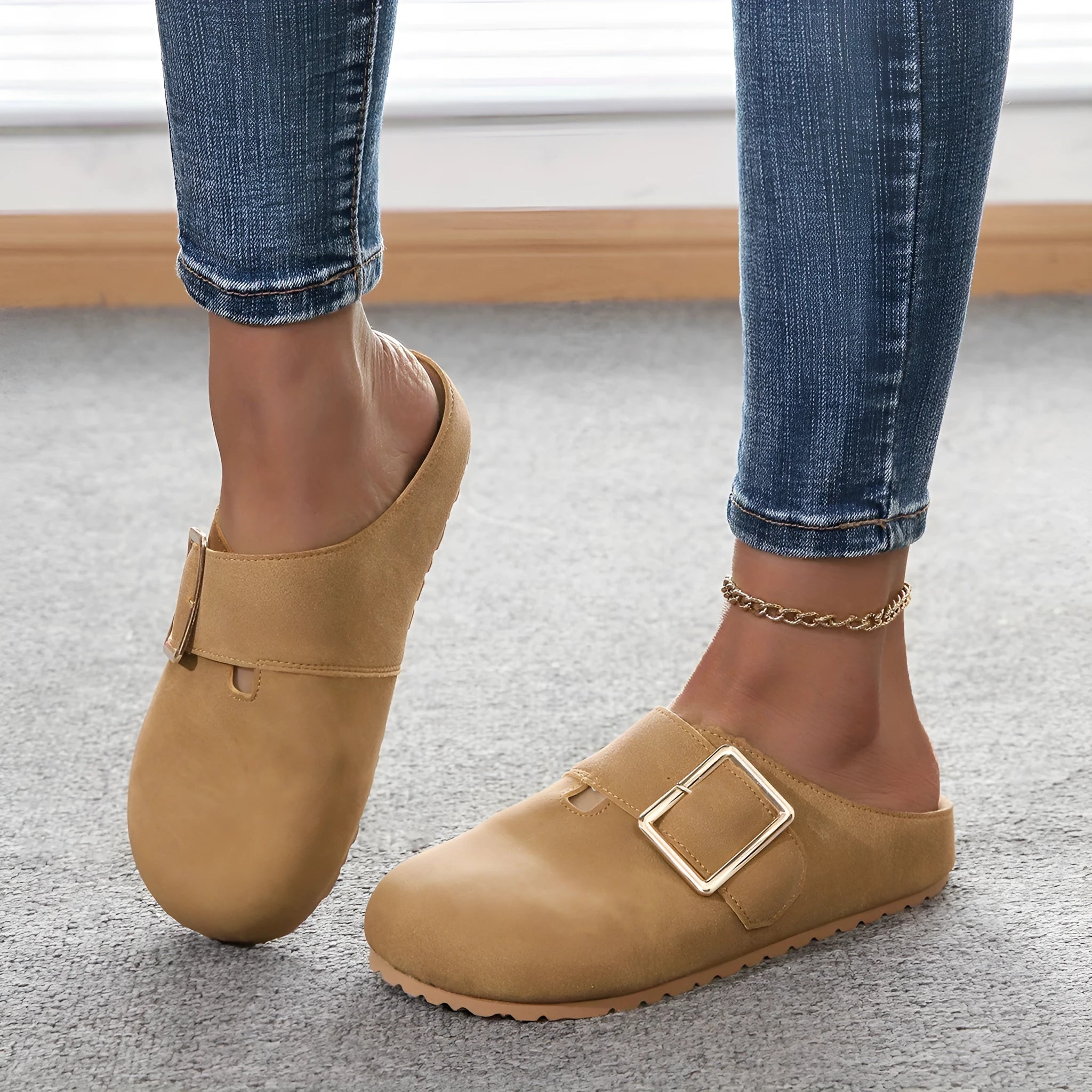 Women's brown closed toe canvas slippers with low top design showing pull-on style and textured canvas upper