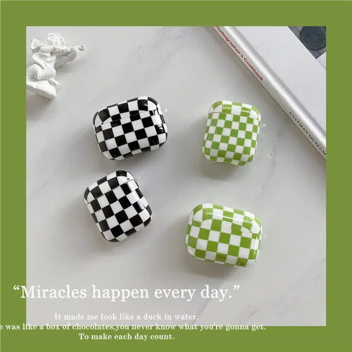 Black and green checkerboard patterned TPU protective case for Apple AirPods with optional lanyard and loop pendant attachments.