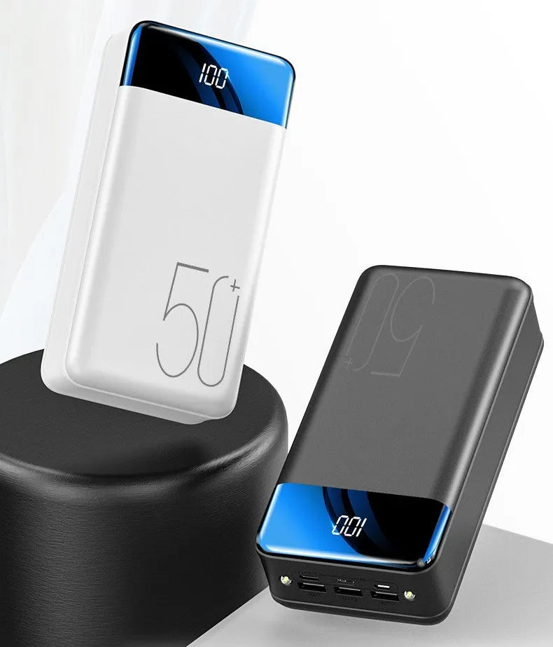 Black large capacity 50000mAh portable power bank with three USB output ports showing size scale.
