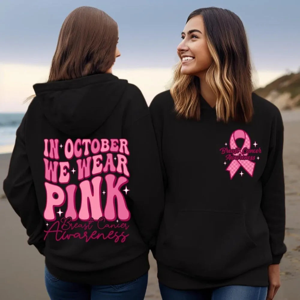 Pink breast cancer awareness pullover hoodie with retro hot stamp design and side pockets.