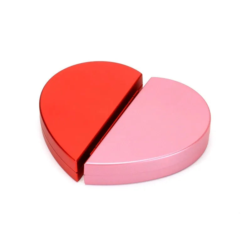 Red heart-shaped plastic ring box with a rose design and rotating 3D love text in the centre.