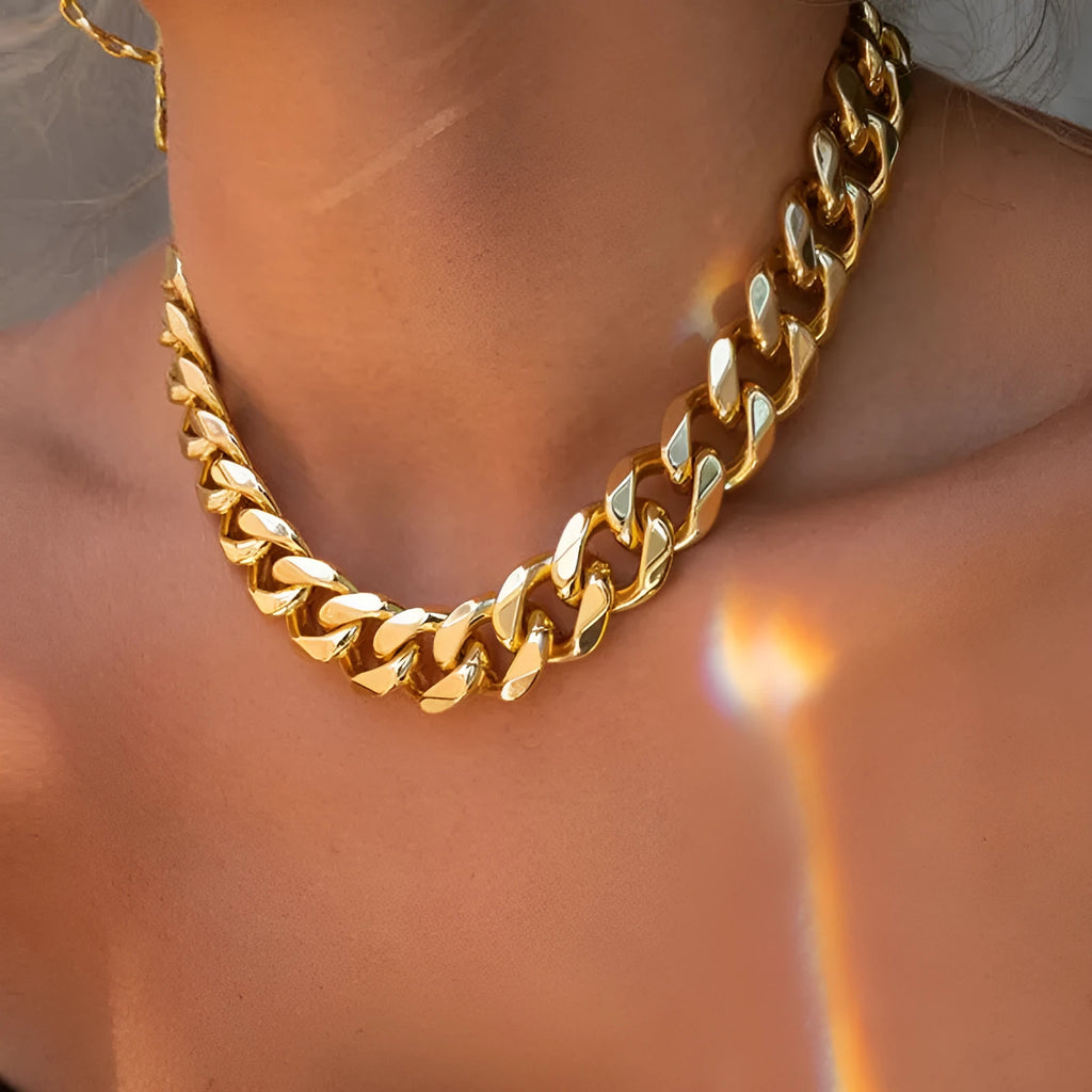 Gold tone women's necklace with thick 6cm chain links on a 32cm alloy chain, electroplated finish.