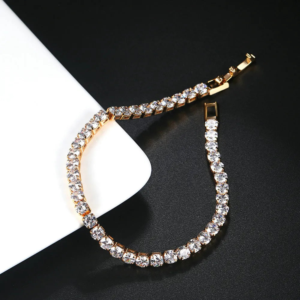 Single row 4mm round zircon bracelet on stainless steel box chain in gold finish