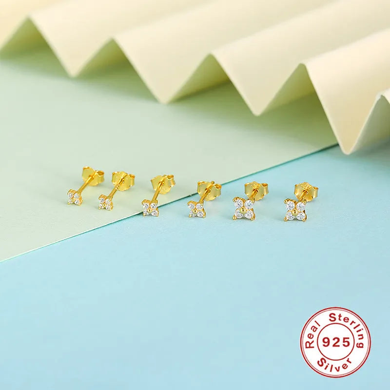 S925 sterling silver stud earrings with a geometric petal and crystal flower design in gold or platinum finish.