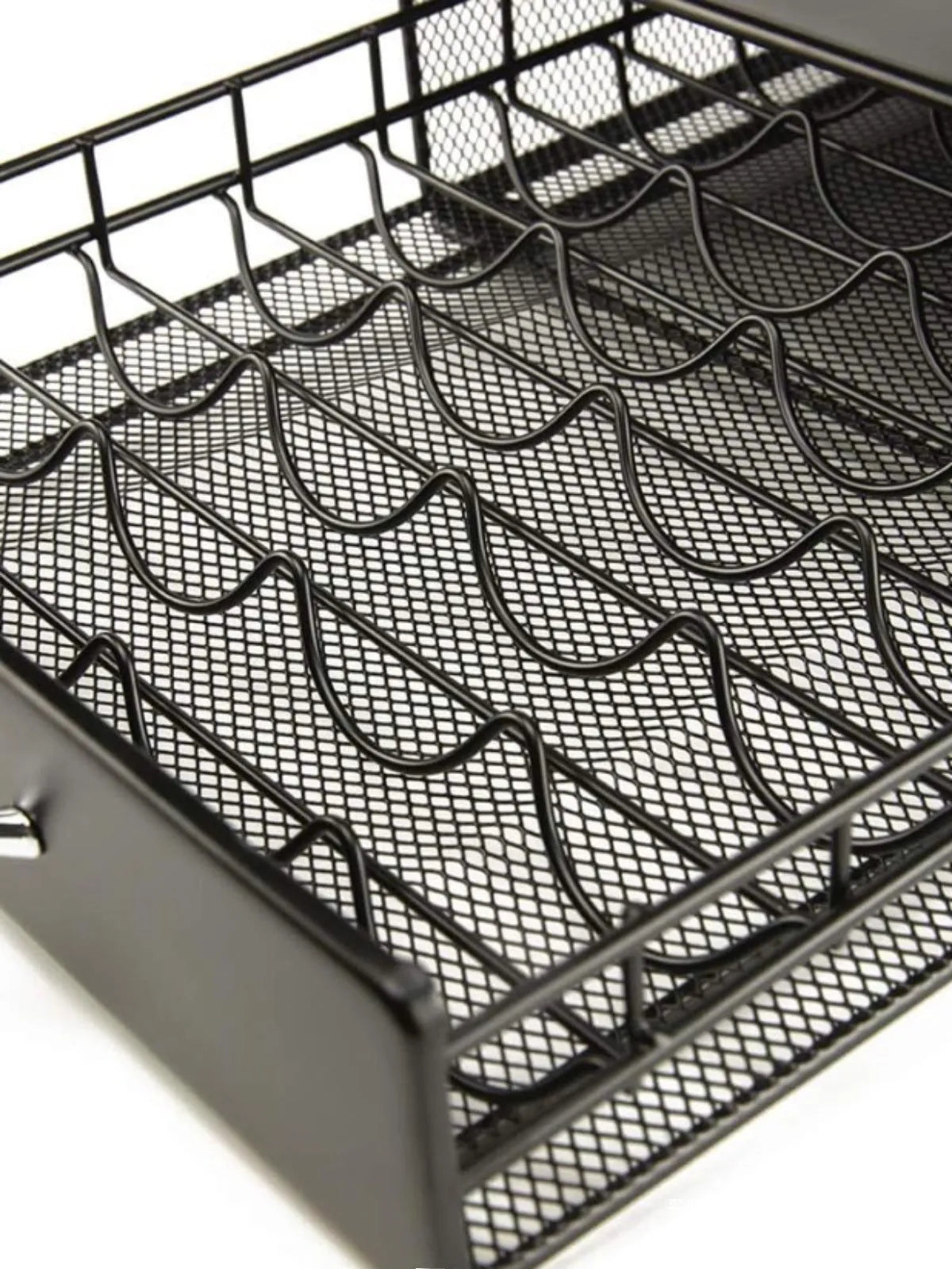 Black coffee capsule storage drawer with silver handle, 40x29x8.5cm, on a cafe countertop