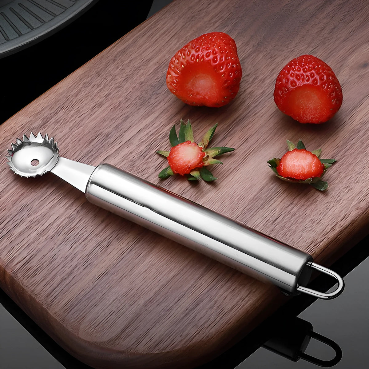 Stainless steel strawberry stem remover, 410 steel, modern minimalist kitchen gadget for hulling strawberries.