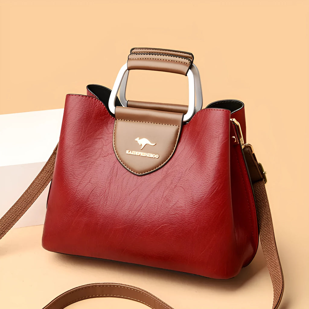 Women's barrel crossbody shoulder bag in soft PU with zip pocket and document pocket, shown in one of six colours