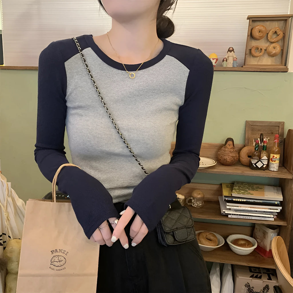 Women's dark blue oversized viscose top with embroidery on the front and princess sleeves.
