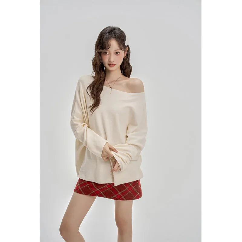 Oblique shoulder soft knit top for women in oatmeal colour with collarbone reveal detail