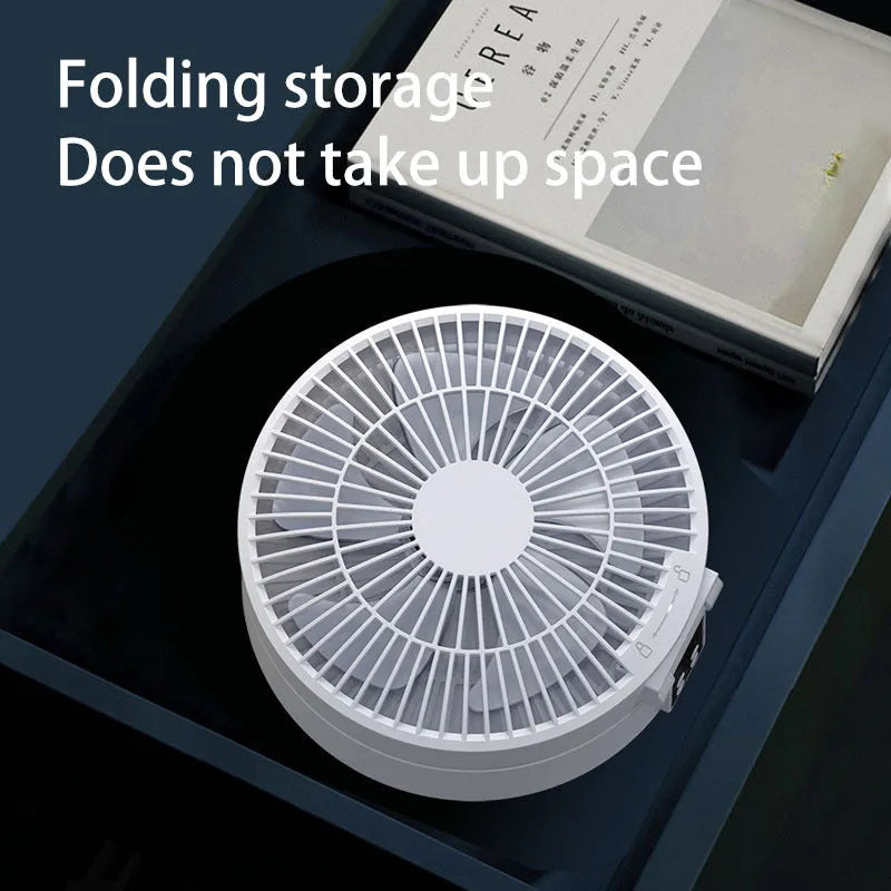White portable folding fan with remote control showing 90° adjustable head and USB charging port