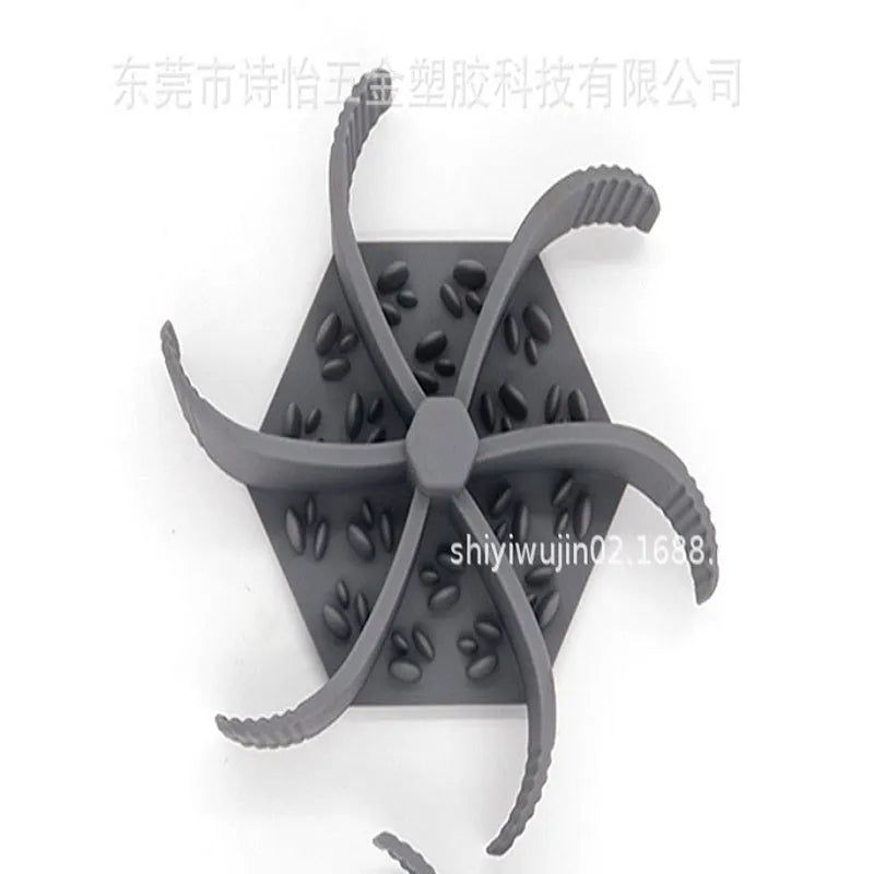Blue silicone pet slow feeder licking pad with suction cup base for dogs and cats.