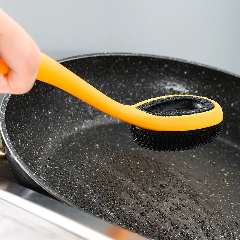 Yellow silicone nylon nonstick cooking spoon spatula kitchen utensils set on surface