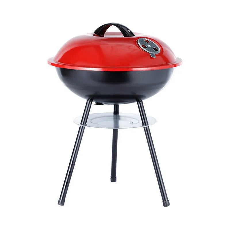 Portable minimalist 14-inch iron barbecue oven grill on a table.