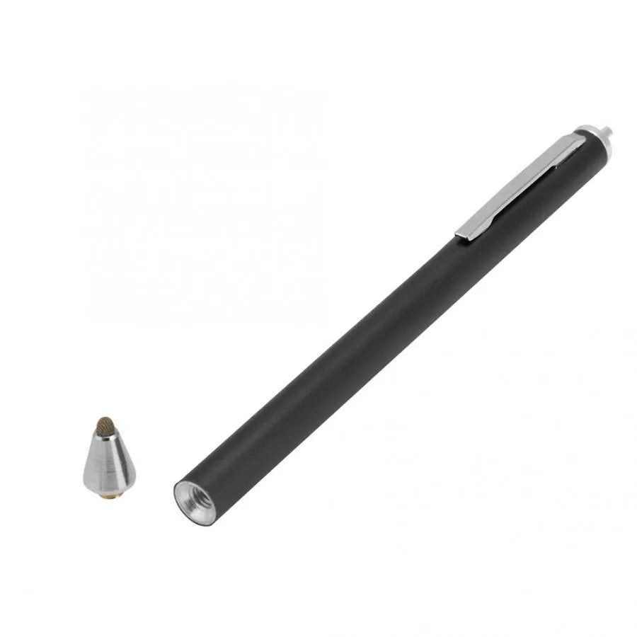 A black metal stylus with a fine point tip positioned next to a mobile phone and tablet on a desk.