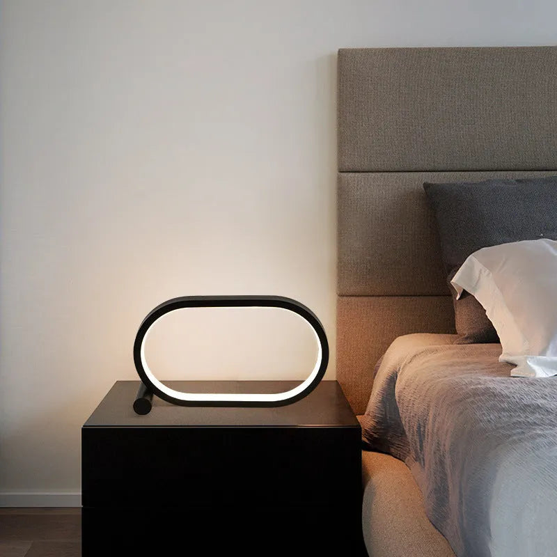 USB plug-in oval acrylic night light with touch control, metal base, and dimmable LED in black