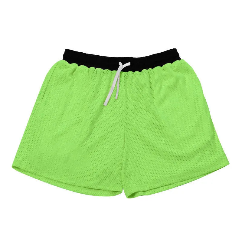 Men's solid colour mesh quick-drying shorts for summer running and fitness.