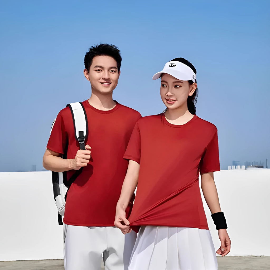 Men's loose fit solid colour polyester sports t-shirt on a hanger, showing short sleeves and casual cut.
