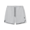 Men's grey seamless sports shorts with knee length and straight cut design for athletic activities