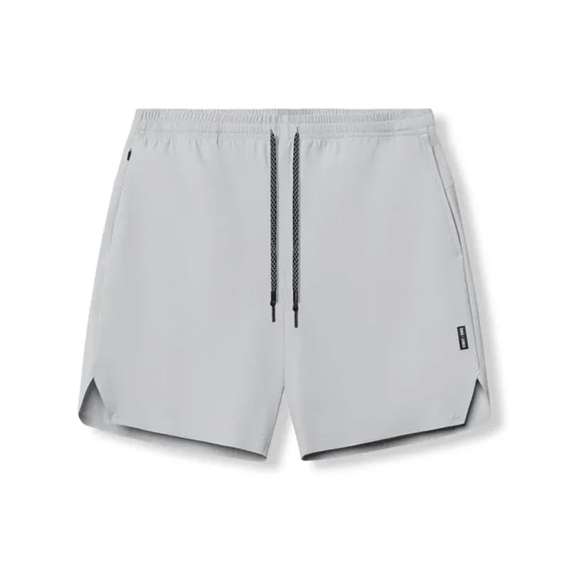 Men's grey seamless sports shorts with knee length and straight cut design for athletic activities