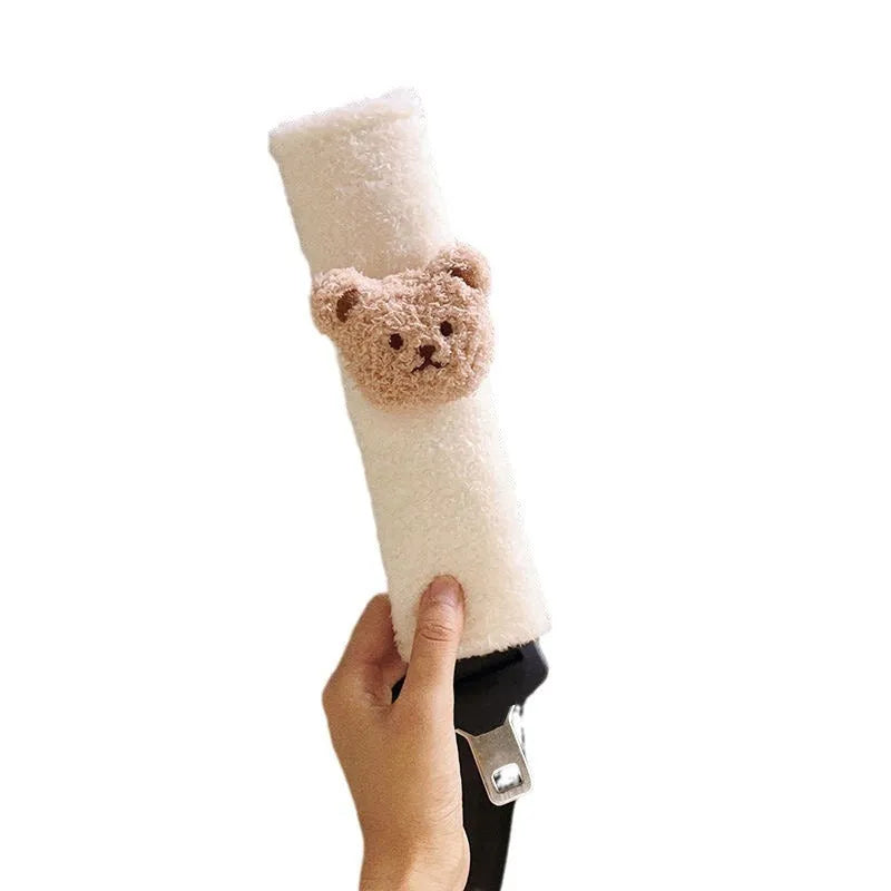 Cartoon bear plush seat belt cover for baby car seats showing khaki and coffee colour options