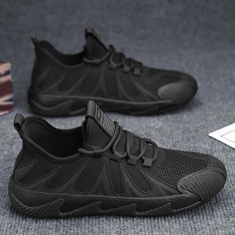 Men's black casual canvas sneakers with lace-up front and breathable mesh panels