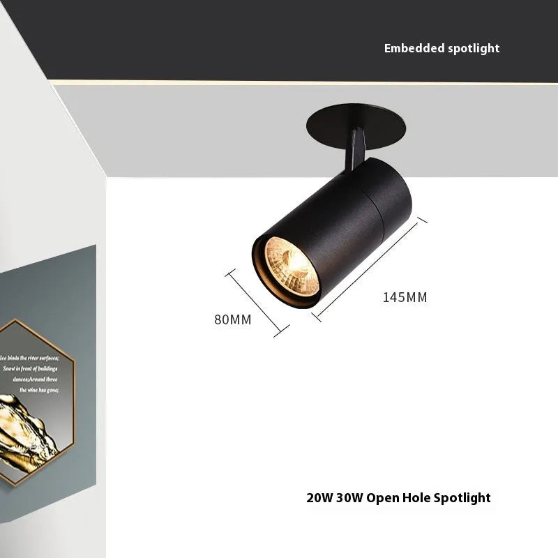 Black and white embedded cylinder LED spotlight for track lighting with selectable power and colour temperature settings.