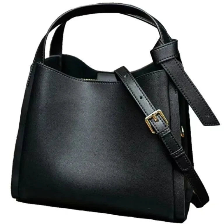 Soft cowhide leather women's crossbody bucket bag in tea brown with zippered interior pockets.