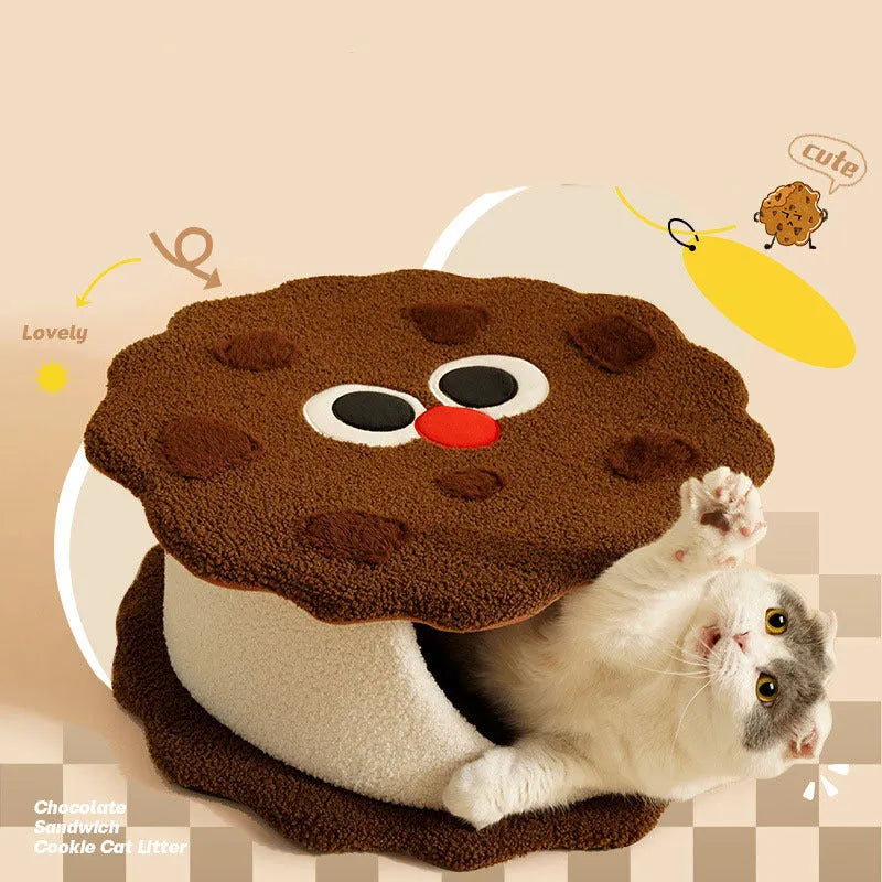 Khaki-coloured enclosed cat nest bed shaped like a sandwich cookie with a high entry wall.