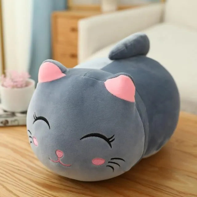 Soft grey fat cat plush doll filled with down cotton on a white background.