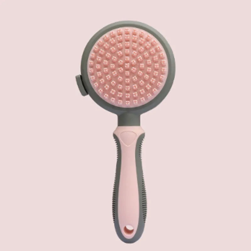 Green and pink dual-sided cat and dog brush with slicker comb and silicone massage head.