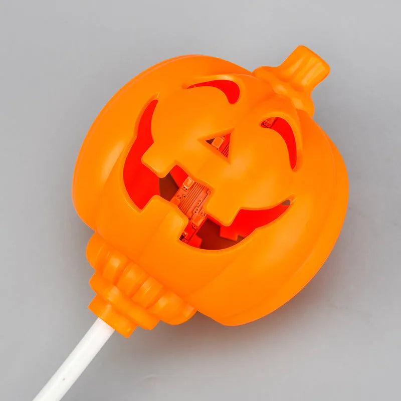 Plastic pumpkin lamp with USB charging cable showing yellow and purple light options