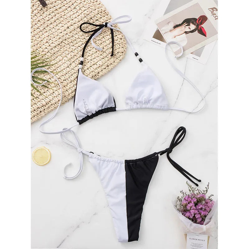 Black and white lace-up triangle bikini set for women, shown as a complete two-piece swimsuit.