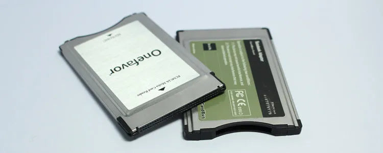 SD to PCMCIA adapter card with stainless steel housing and a 32GB SD card for Mercedes-Benz cars.