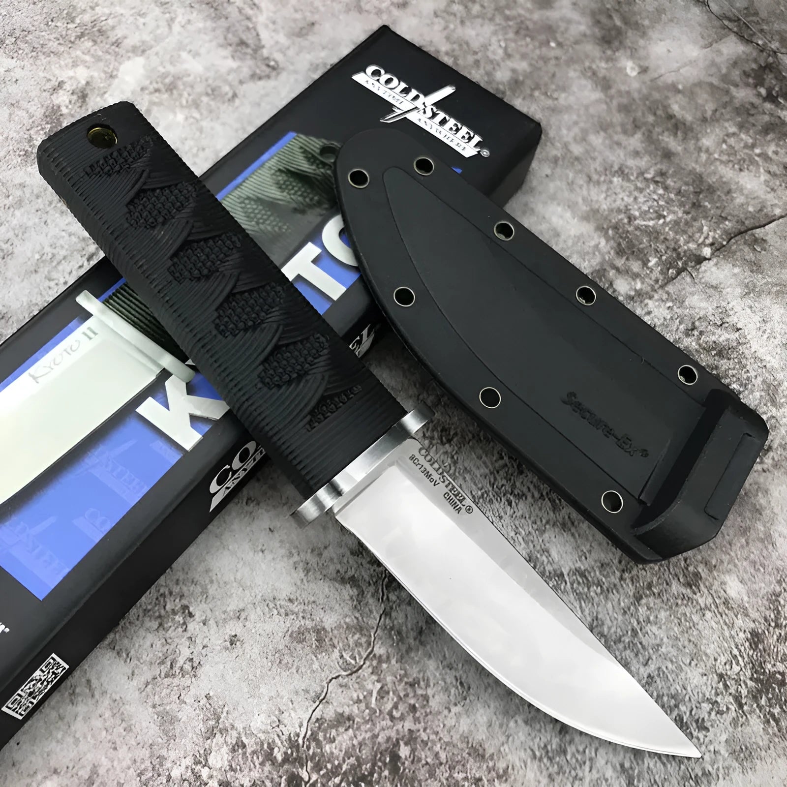 Mini straight knife with 440C steel blade, ABS handle, and holster on outdoor surface