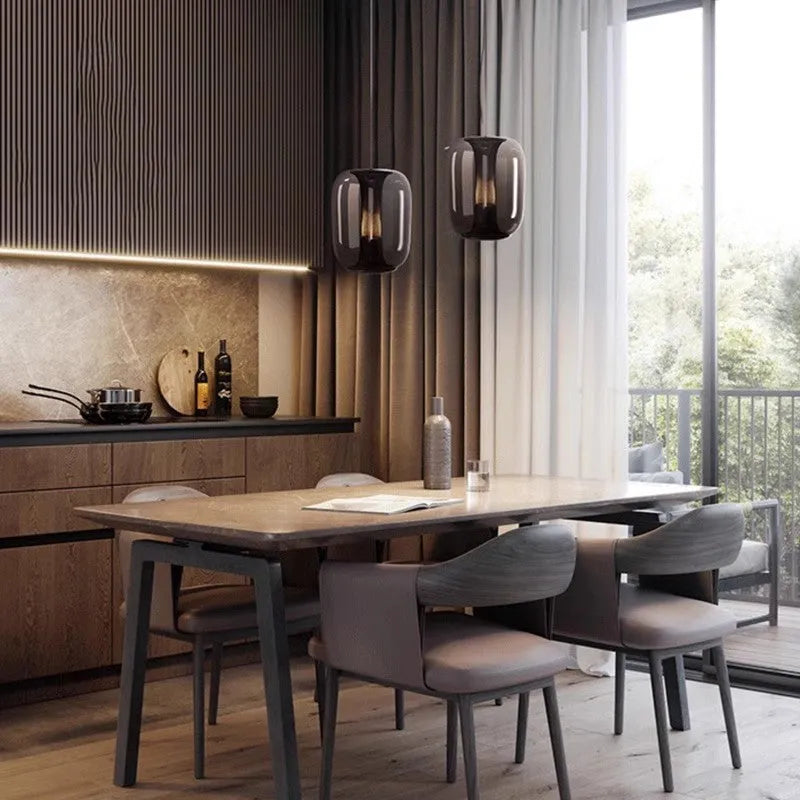 Minimalist Nordic pendant light with a spherical glass globe shade in smoky grey colour.