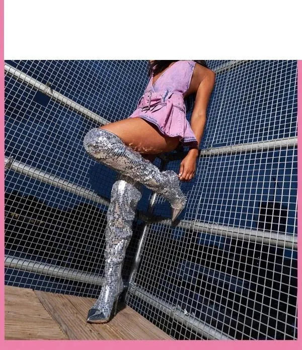 Women's black sequin over-the-knee boots with PU leather upper on display