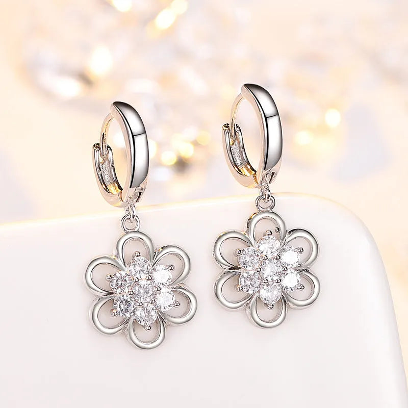 Floral white copper earrings with faceted stone accent, available as ear stud or ear hook in purple or white colour options