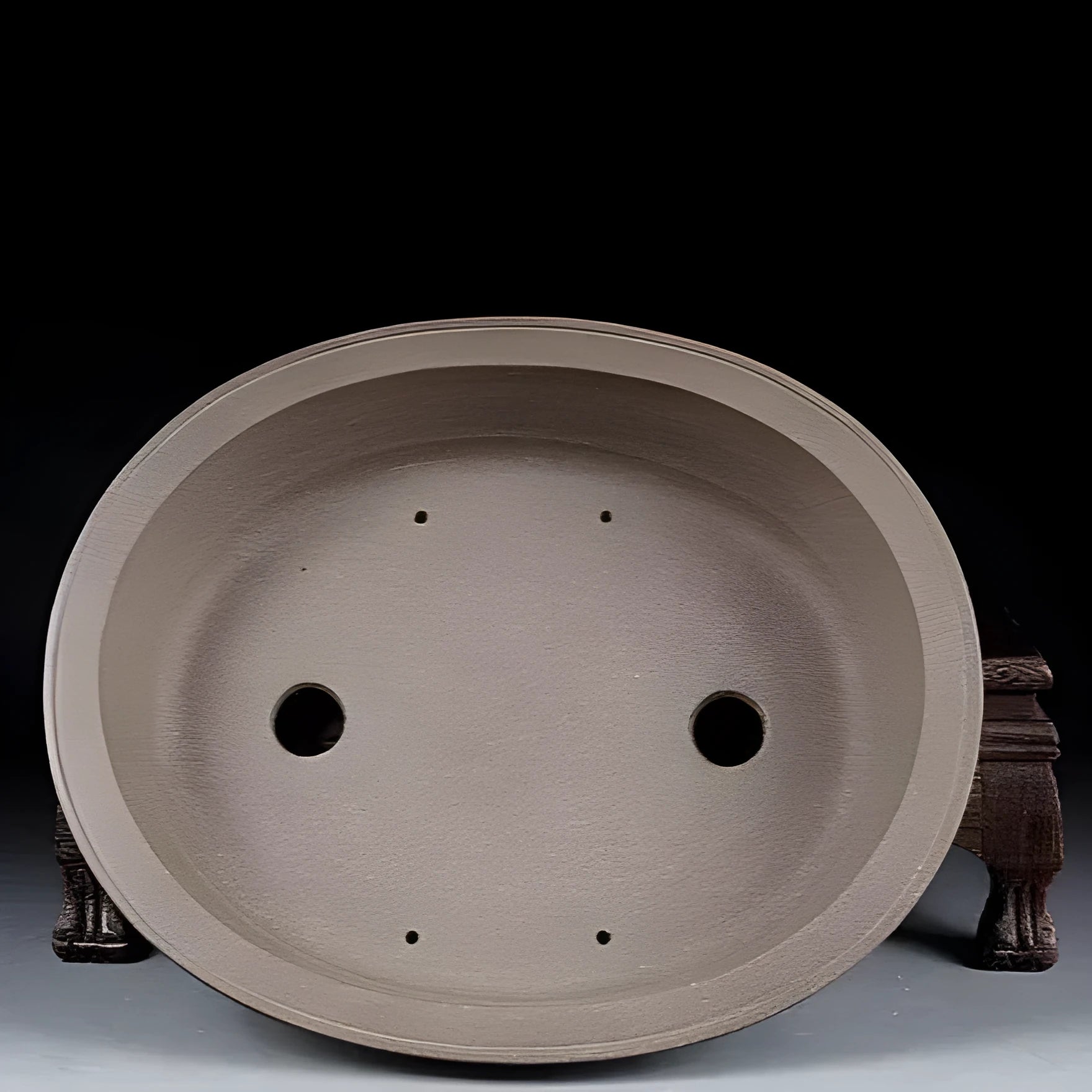 Handmade antique oval bonsai flower pot in purple sand clay, showing its 25cm length and 6.3cm depth.
