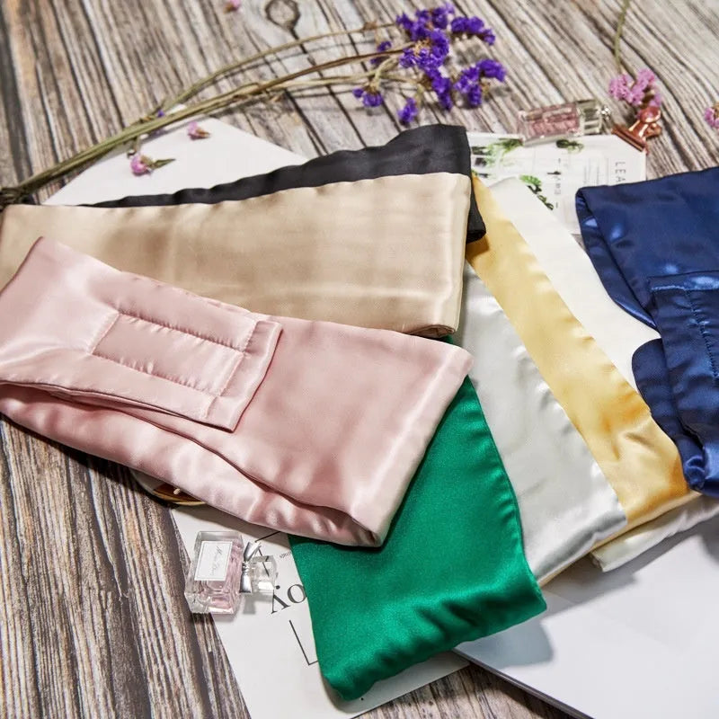 A mulberry silk sleep mask in Champagne Gold colour, shown folded and flat.