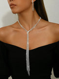 Silver curb chain necklace with rhinestone pendant and matching long earrings in a three-piece set for women