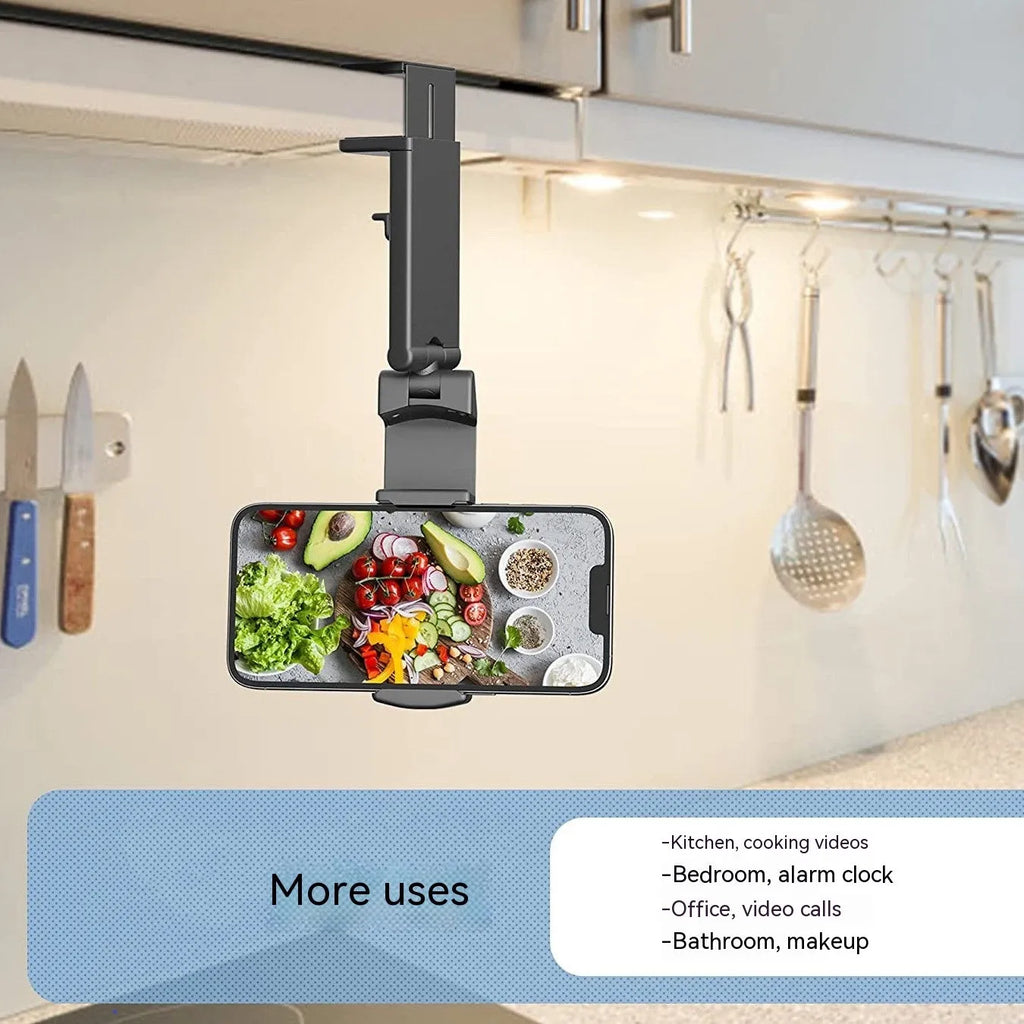 Black foldable and rotating universal mobile phone holder on a table.