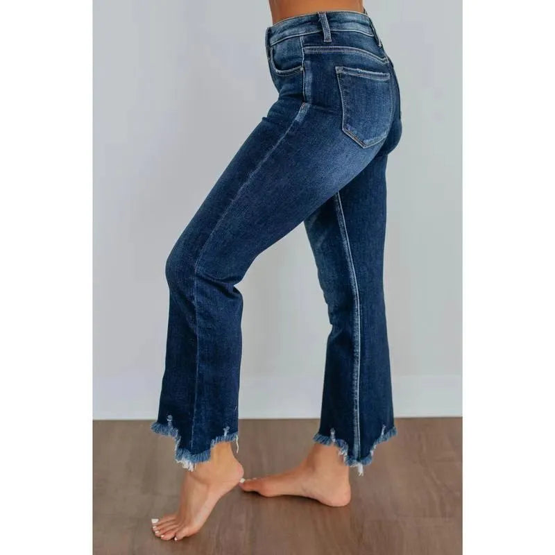 Women's casual denim trousers with manual distressing in dark blue or light blue.