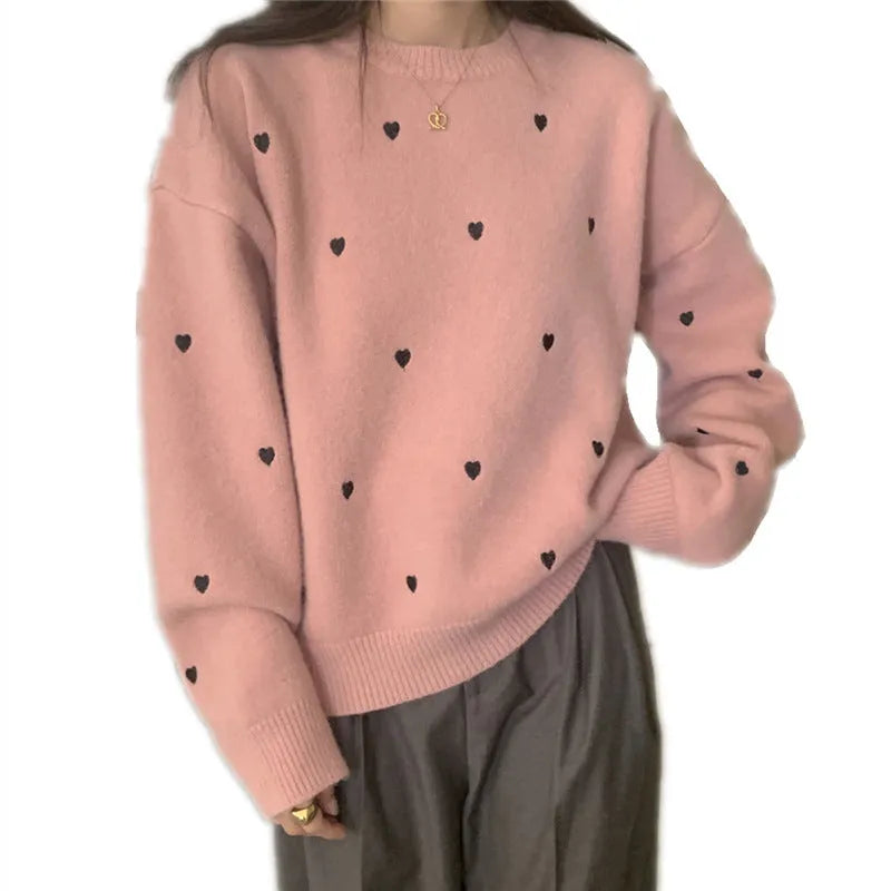 Beige women's loose knit acrylic cardigan with embroidery on the front, featuring long sleeves and a crew neck.