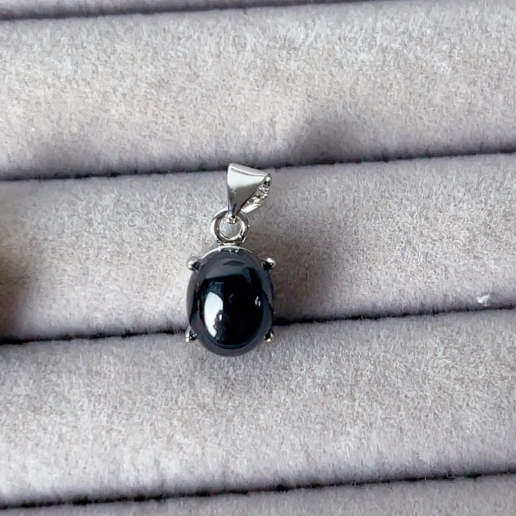 Copper open ring with crystal inlay, geometric shape, black tourmaline colour, on white background