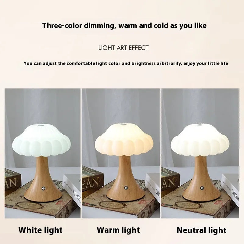 Wood grain coloured mushroom-shaped touch lamp with USB charging port on a bedside table.