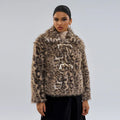 Women's leopard print coat with a buckle lapel closure on a street fashion model.