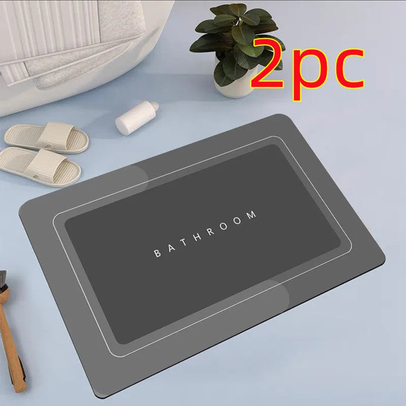 Diatom mud absorbent bathroom floor mat in blue rectangular shape on tiled floor