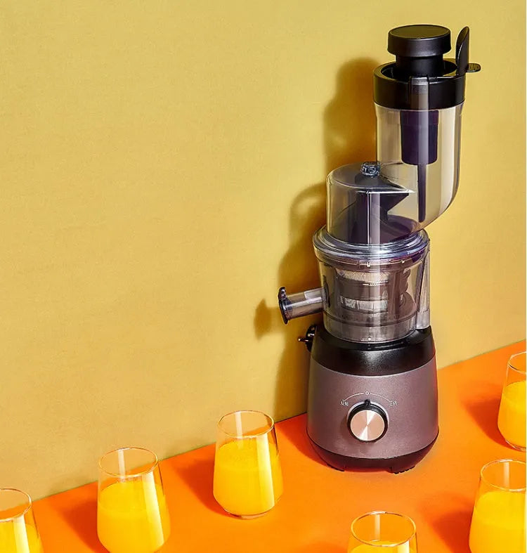 Grey slow masticating juicer with 90mm feed chute and multi-function separator on countertop